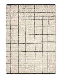 Black and ivory handwoven cotton rug with irregular windowpane grid pattern