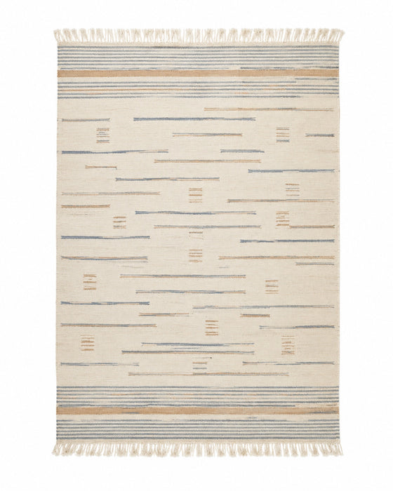Blue and beige handwoven cotton rug with abstract dash pattern and fringe