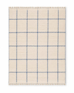 Blue and ivory handwoven cotton rug with windowpane check and fringe
