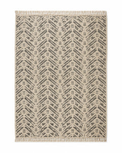 Charcoal and beige handwoven cotton rug with dense herringbone geometric pattern
