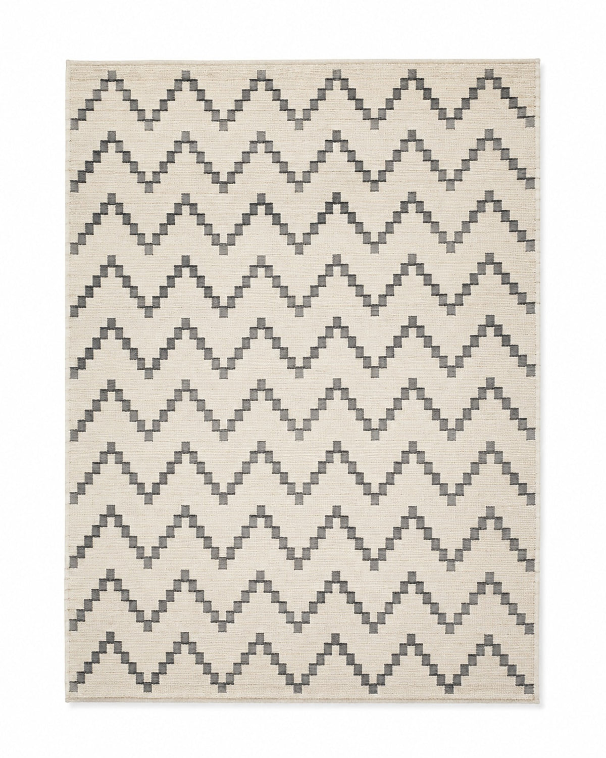 Charcoal and ivory handwoven cotton rug with repeating chevron pattern