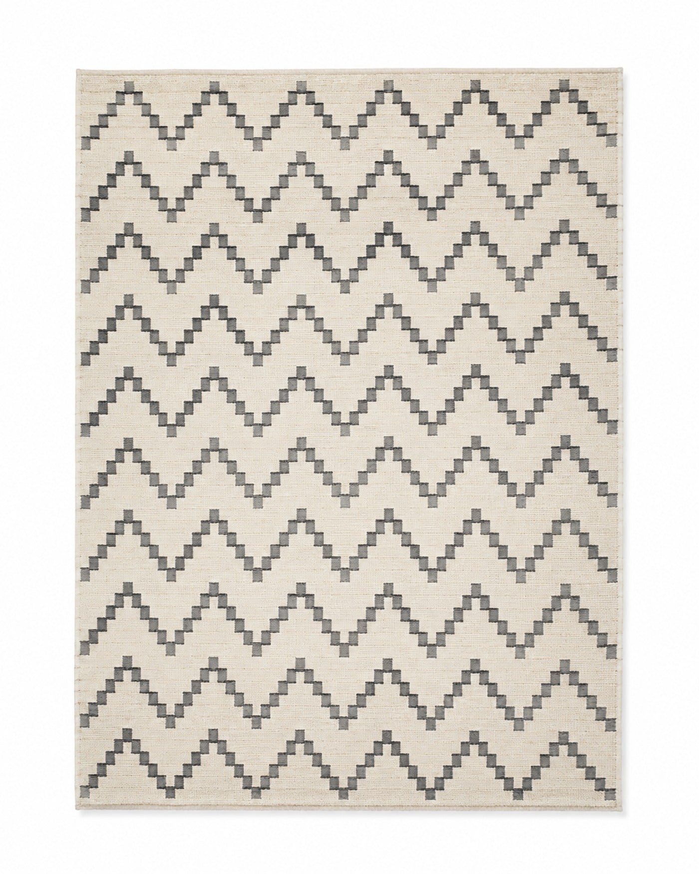 Charcoal and ivory handwoven cotton rug with repeating chevron pattern