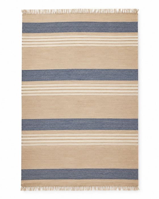 Navy and beige handwoven cotton rug with wide horizontal stripes and fringe