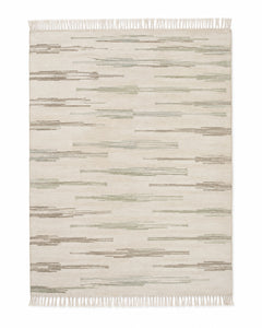 Sage and beige handwoven cotton rug with abstract broken stripe texture and fringe