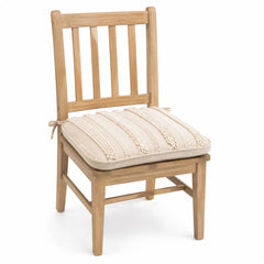 Primeval ivory and beige textured stripe dining chair pad with tie straps on wooden dining chair