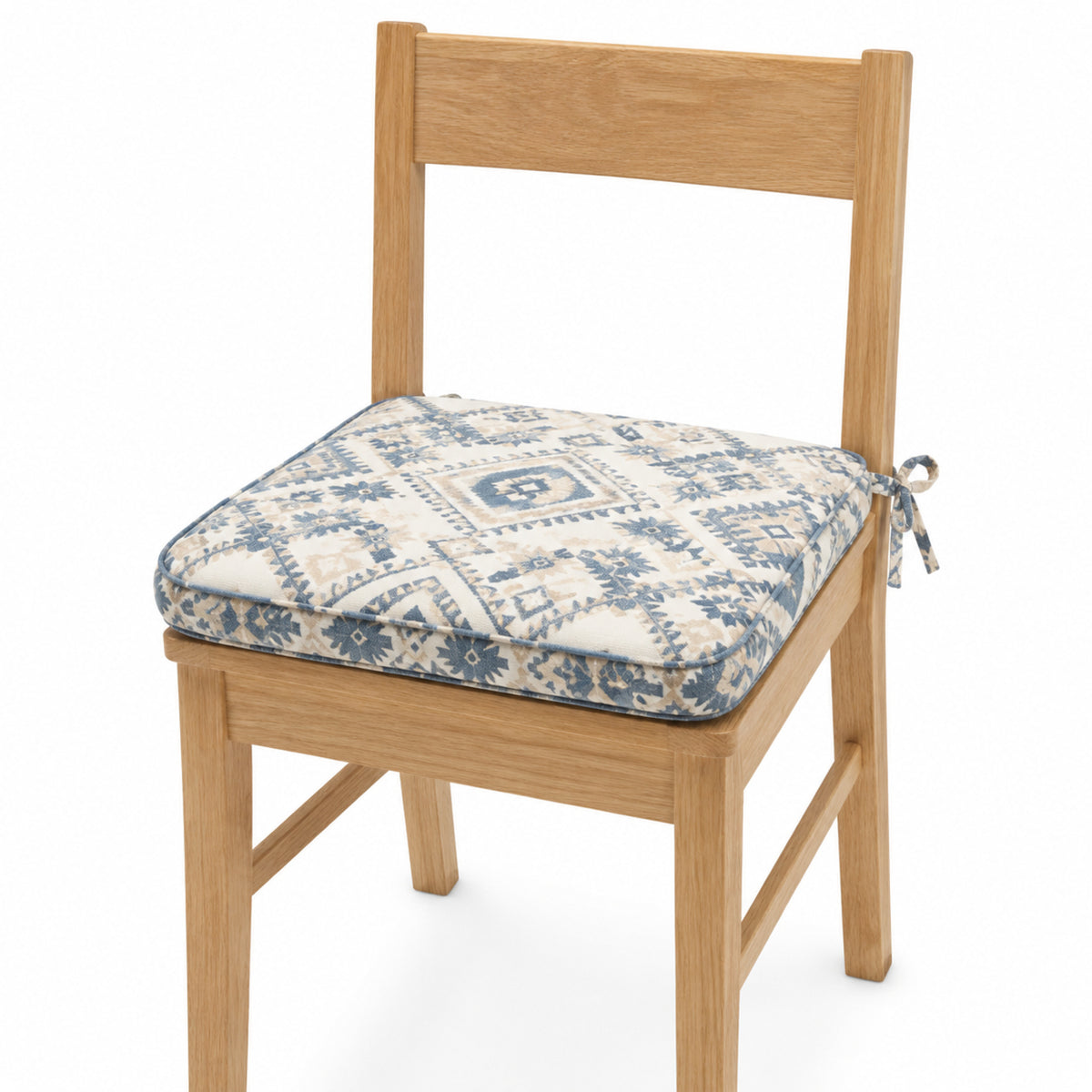 Primeval ivory and blue diamond geometric dining chair pad with tie straps on wooden dining chair
