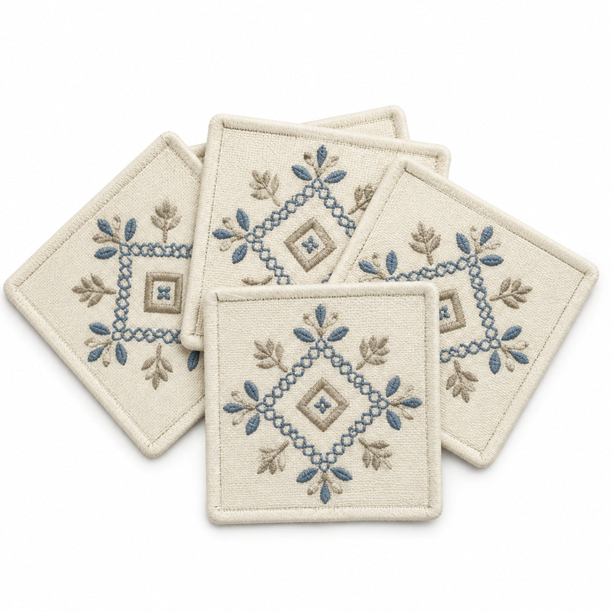 Ivory blue taupe embroidered coaster set on a clean white background