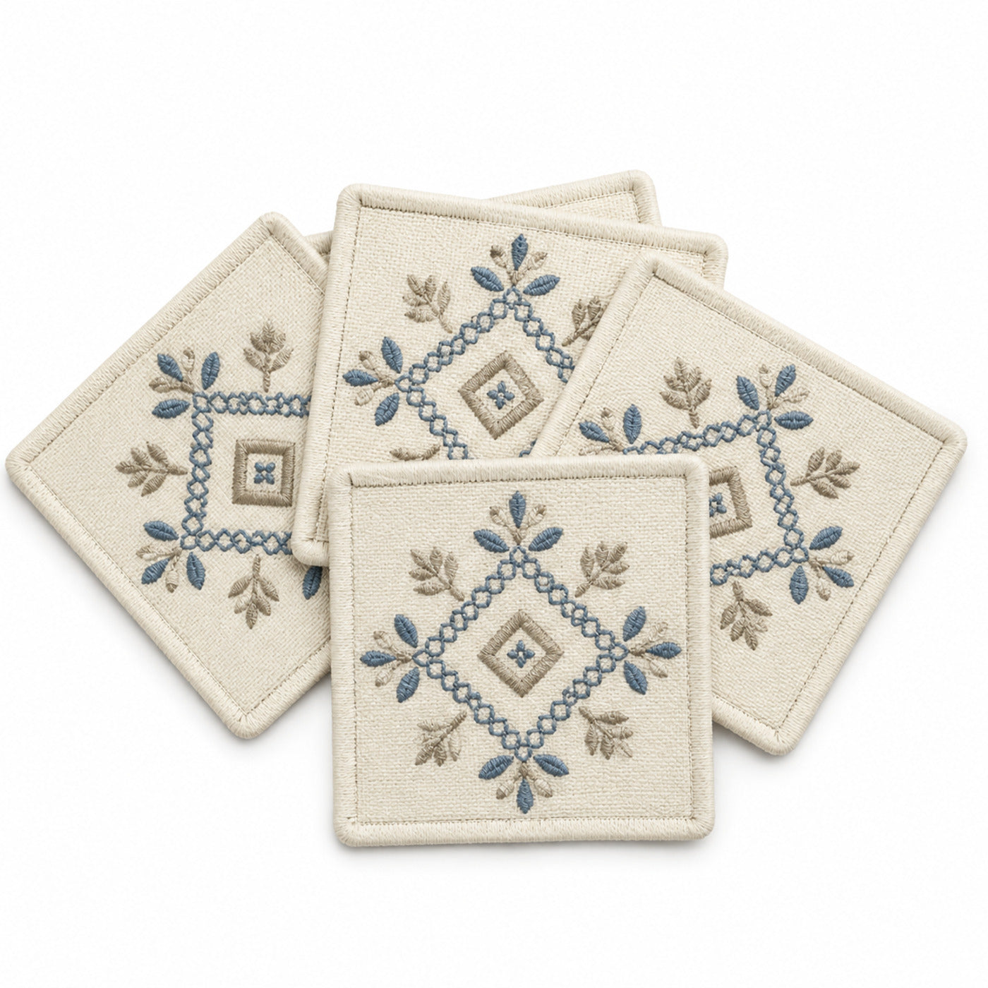 Ivory blue taupe embroidered coaster set on a clean white background