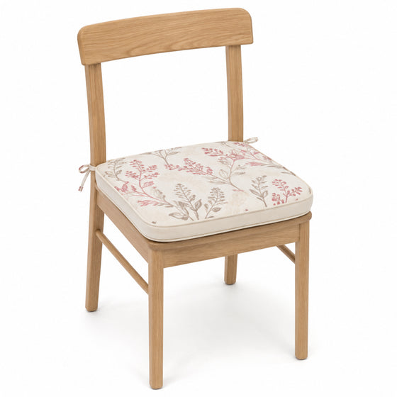 Primeval ivory and blush botanical dining chair pad with tie straps on wooden dining chair