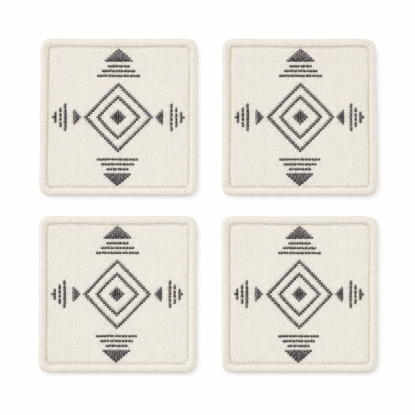 Ivory charcoal Scandinavian geometric coaster set on a clean white background