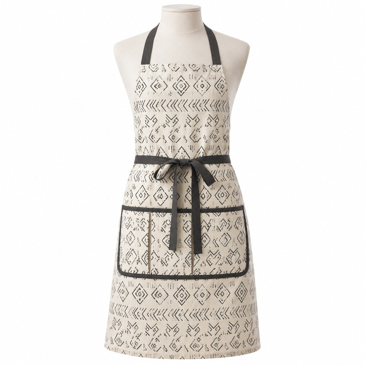 Primeval ivory chef apron with charcoal Scandinavian-style print displayed on a dress form