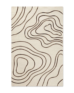 Ivory and chocolate brown cut-pile area rug with flowing topographic contour-line pattern on a white background.