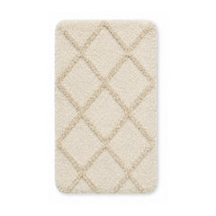 Ivory diamond tufted plush bath mat on white background
