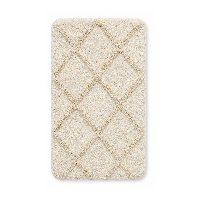 Ivory diamond tufted plush bath mat on white background