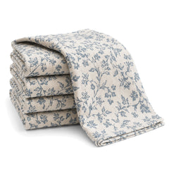 Primeval ivory and dusty blue floral vine print cotton kitchen towel set in folded studio presentation