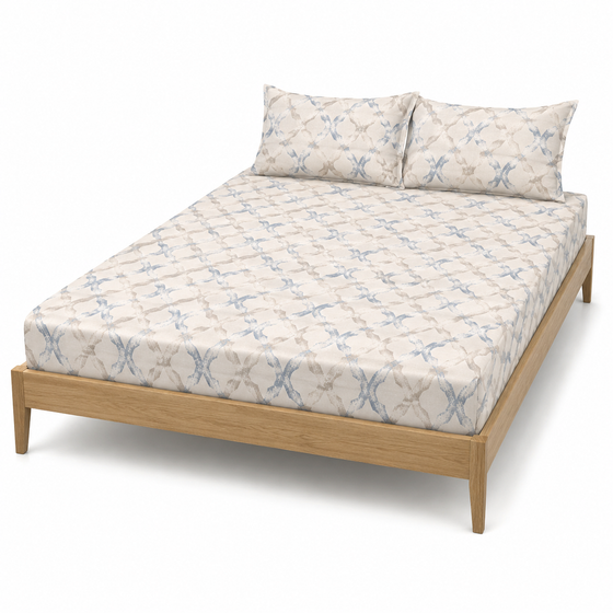 Ivory and dusty blue lattice-pattern bed sheet set with matching pillowcases on a wooden bed