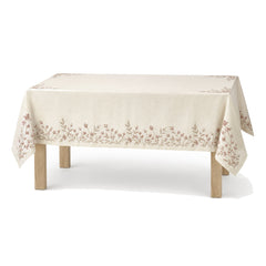 Primeval ivory dusty rose taupe botanical embroidery tablecloth displayed on a rectangular dining table