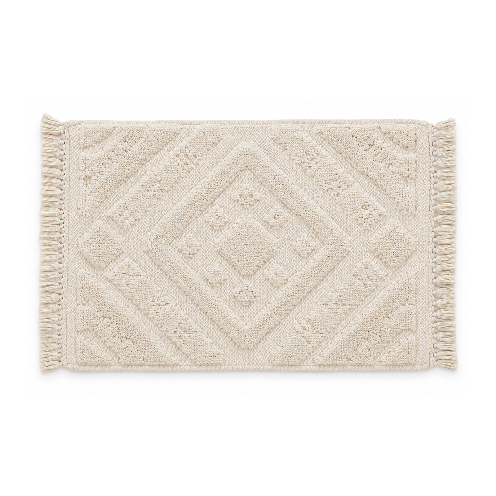 Ivory geometric tufted bath mat with textured pattern on white background