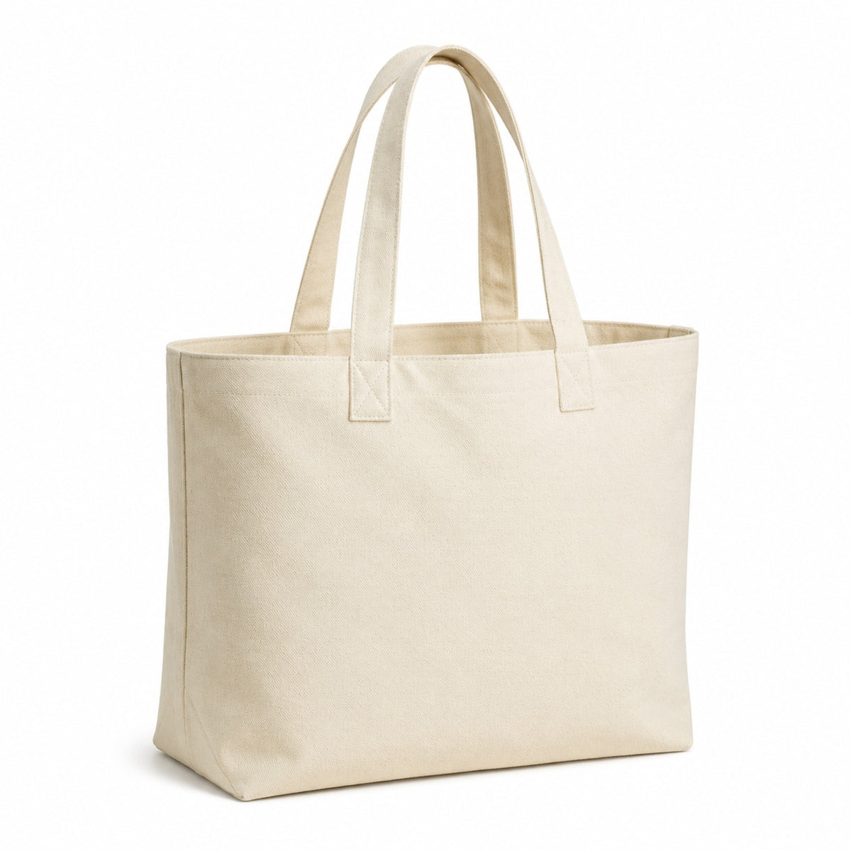 Ivory heavy canvas tote bag with a wide gusset and long cotton handles on a white background.
