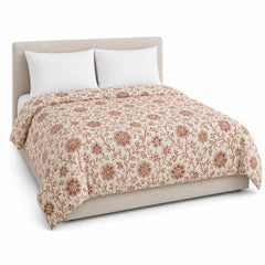 Primeval ivory muted rust traditional floral duvet cover displayed on a styled bed against a clean white studio background