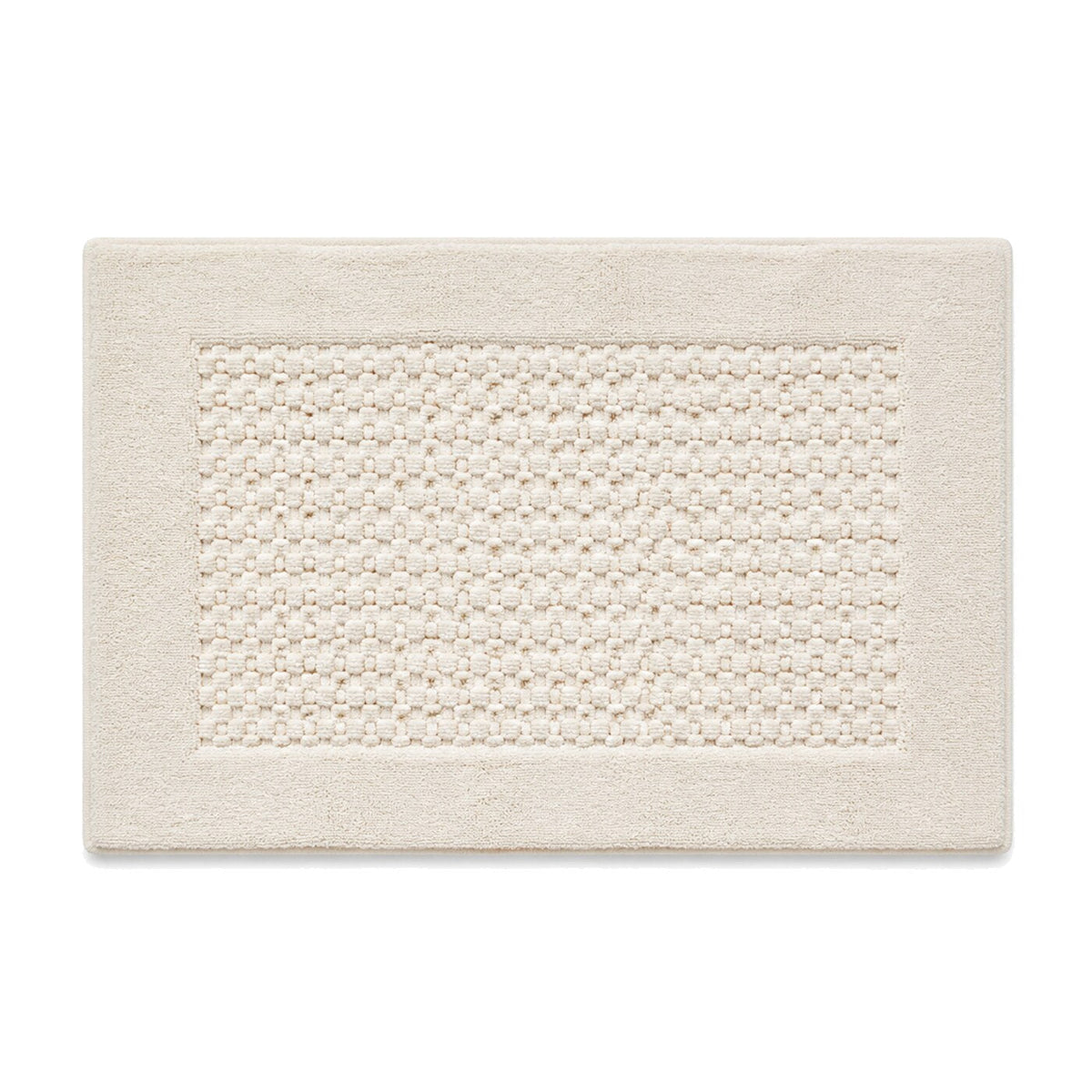 Ivory pebble texture bath mat with raised center surface for neutral bathroom decor - Primeval
