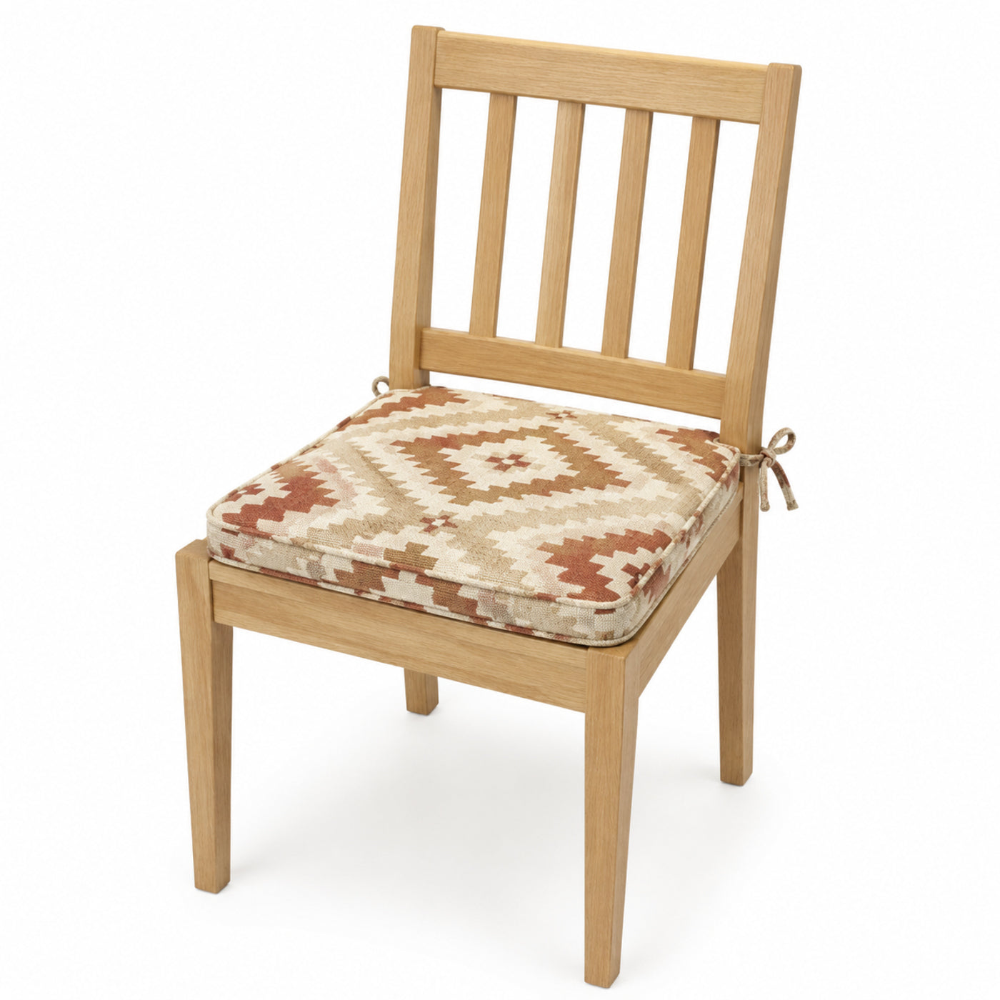 Primeval ivory and rust kilim geometric dining chair pad with tie straps on wooden dining chair