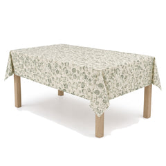 Primeval ivory sage botanical block print tablecloth displayed on a rectangular dining table
