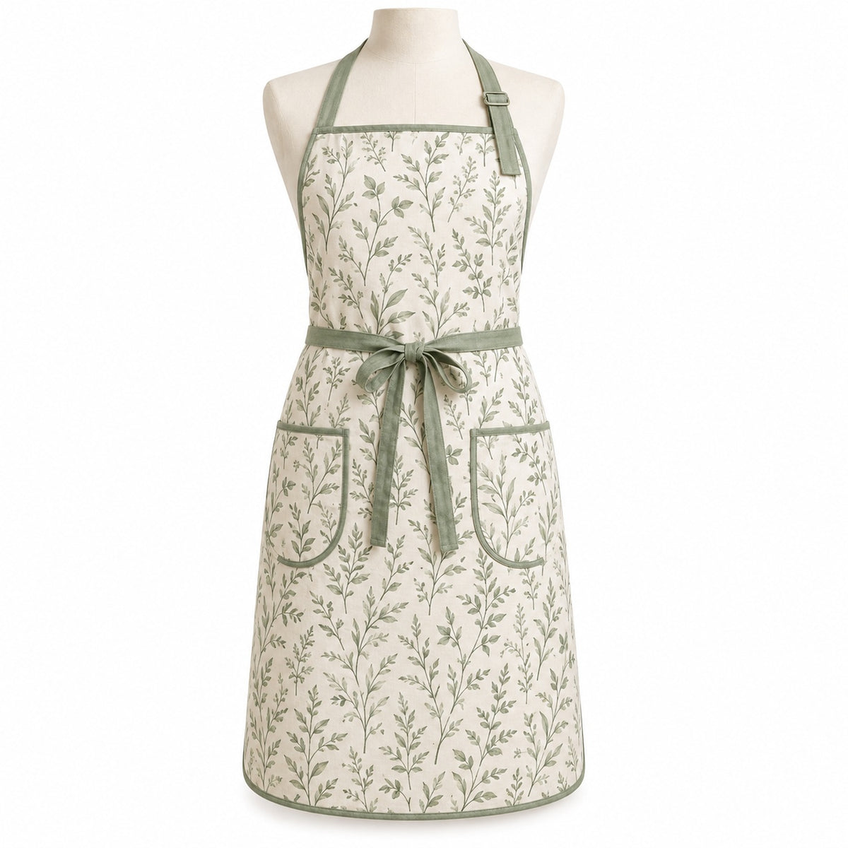 Primeval ivory chef apron with sage botanical print displayed on a dress form