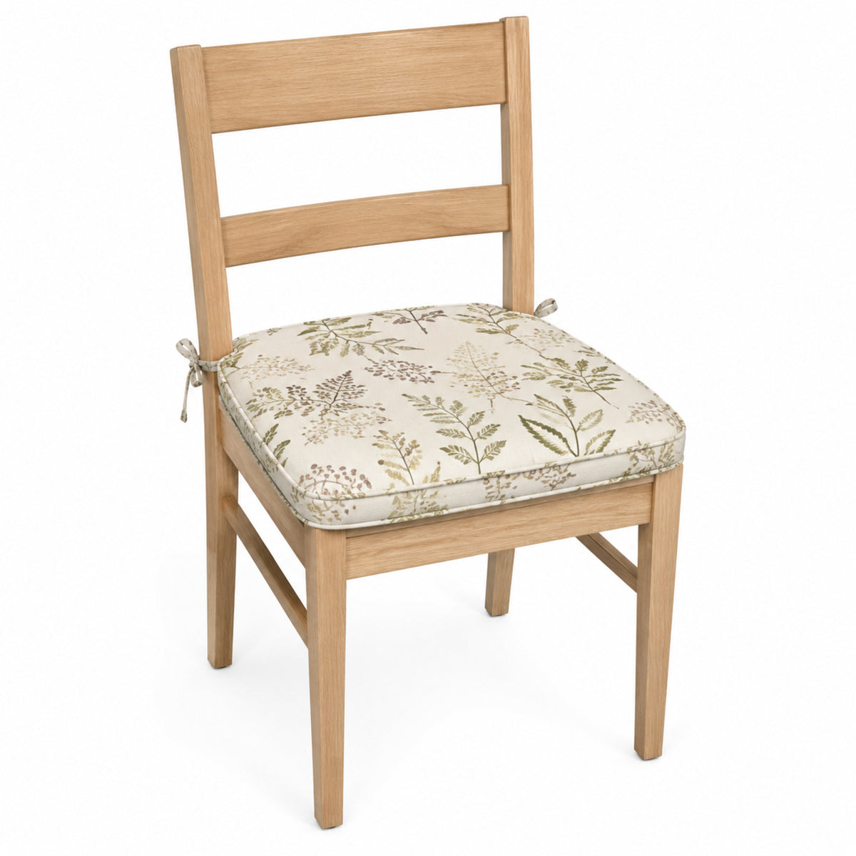 Primeval ivory and sage botanical print dining chair pad with tie straps on wooden dining chair