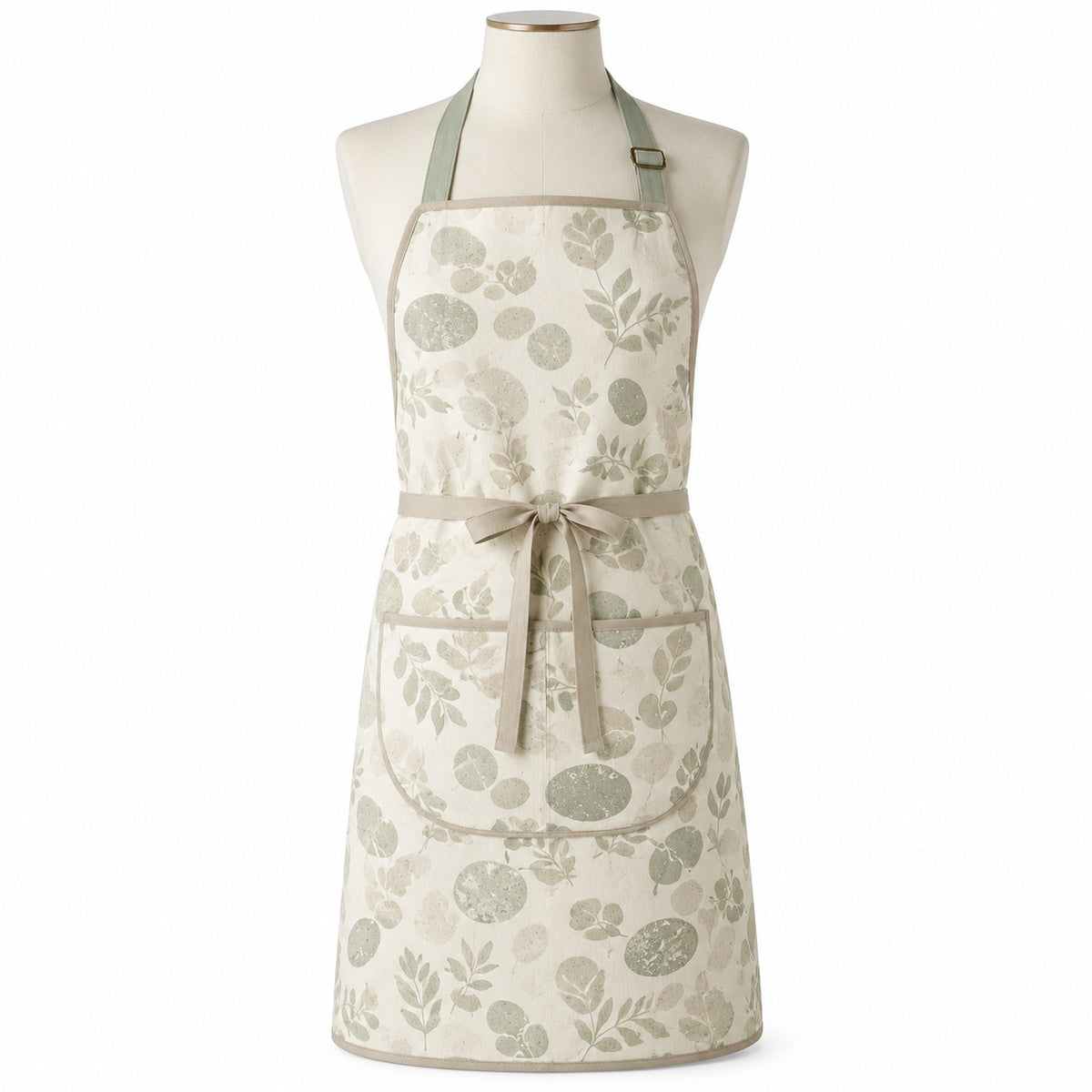 Primeval ivory chef apron with sage organic print displayed on a dress form
