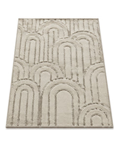 Ivory and taupe hand-tufted area rug with layered arch motifs on a white background.
