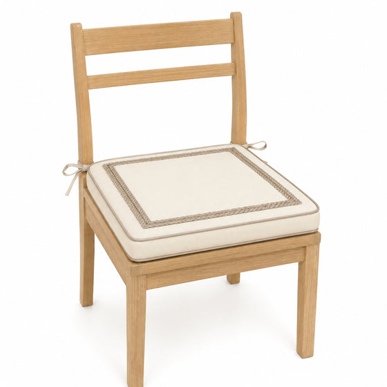 Primeval ivory and taupe double border dining chair pad with tie straps on wooden dining chair