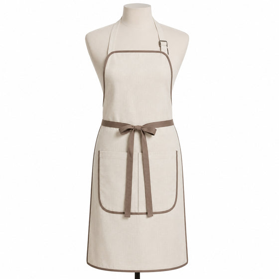 Primeval ivory chef apron with taupe piping and double front pockets displayed on a dress form