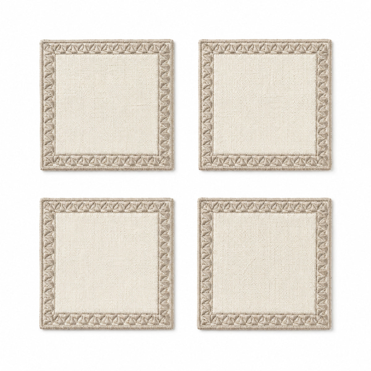 Ivory taupe sculpted border coaster set on a clean white background