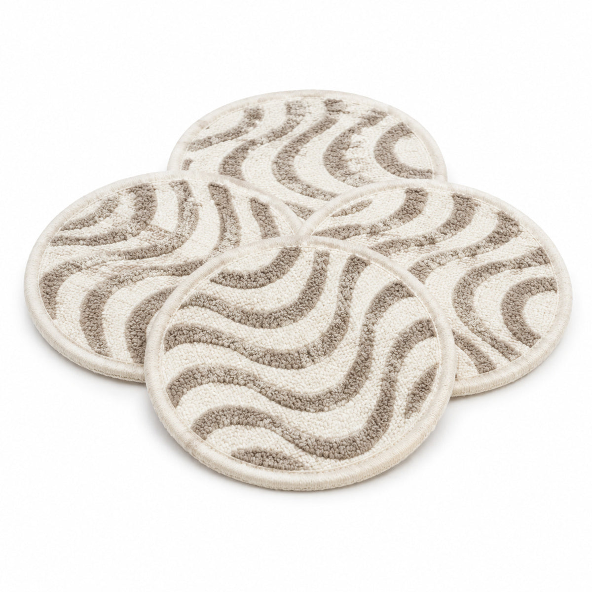 Ivory taupe wave pattern coaster set on a clean white background