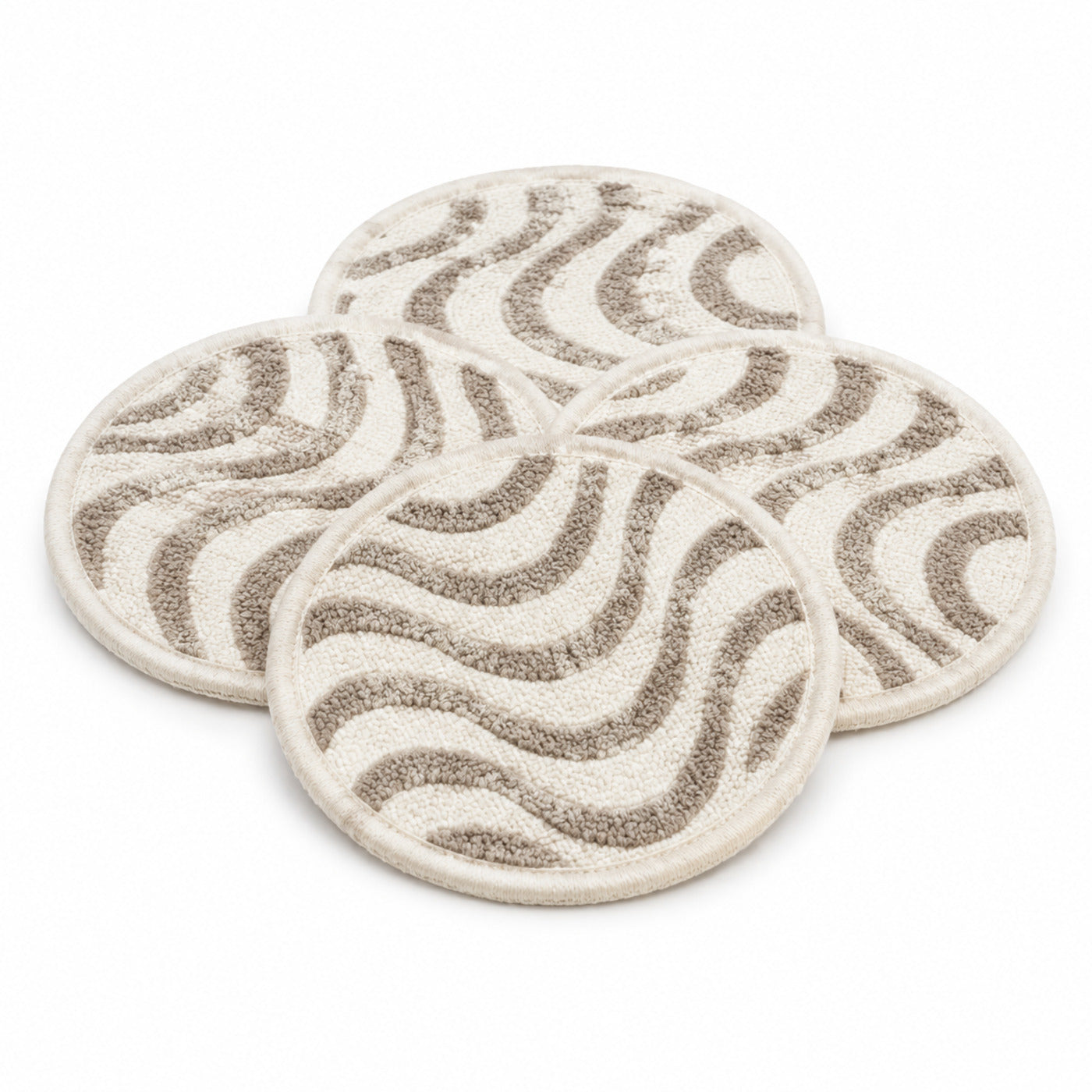 Ivory taupe wave pattern coaster set on a clean white background
