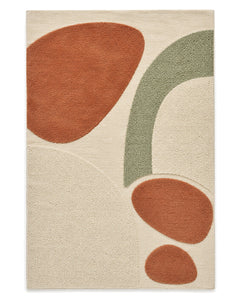 Ivory, terracotta and sage mixed-texture area rug with large organic abstract shapes on a white background.