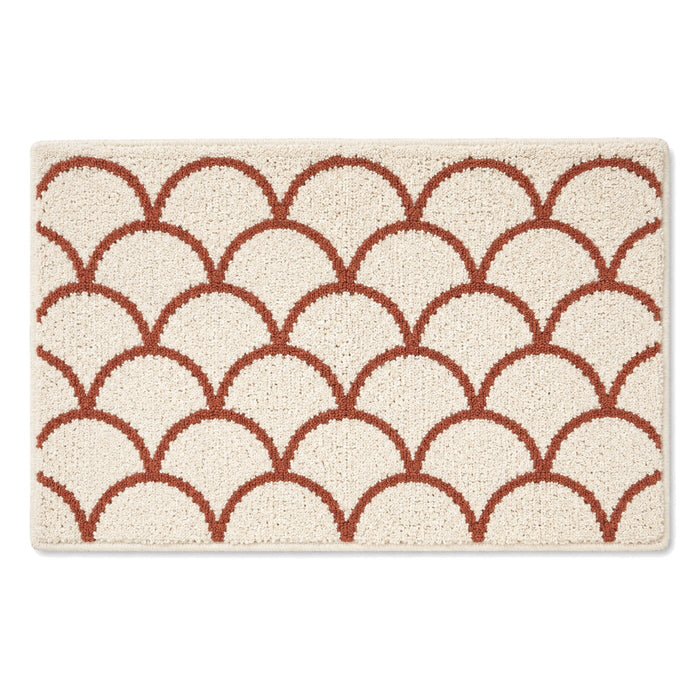 Ivory and terracotta scallop bath mat for warm modern bathroom decor - Primeval