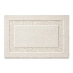 Ivory textured border bath mat in a neutral minimalist style - Primeval