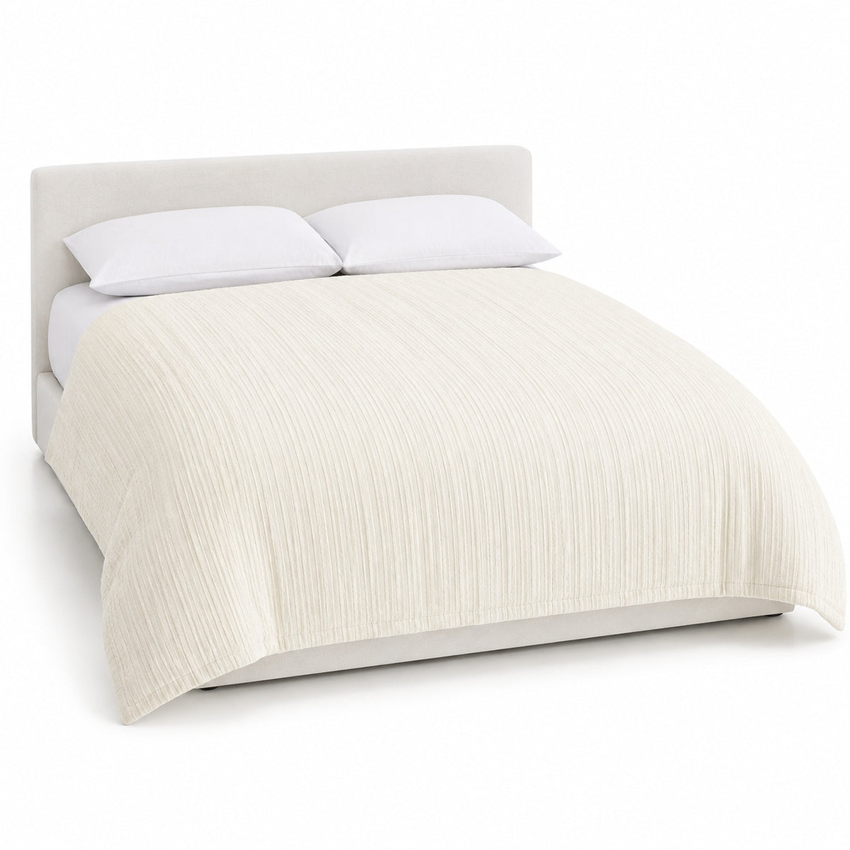 Primeval ivory vertical textured stripe duvet cover displayed on a styled bed against a clean white studio background