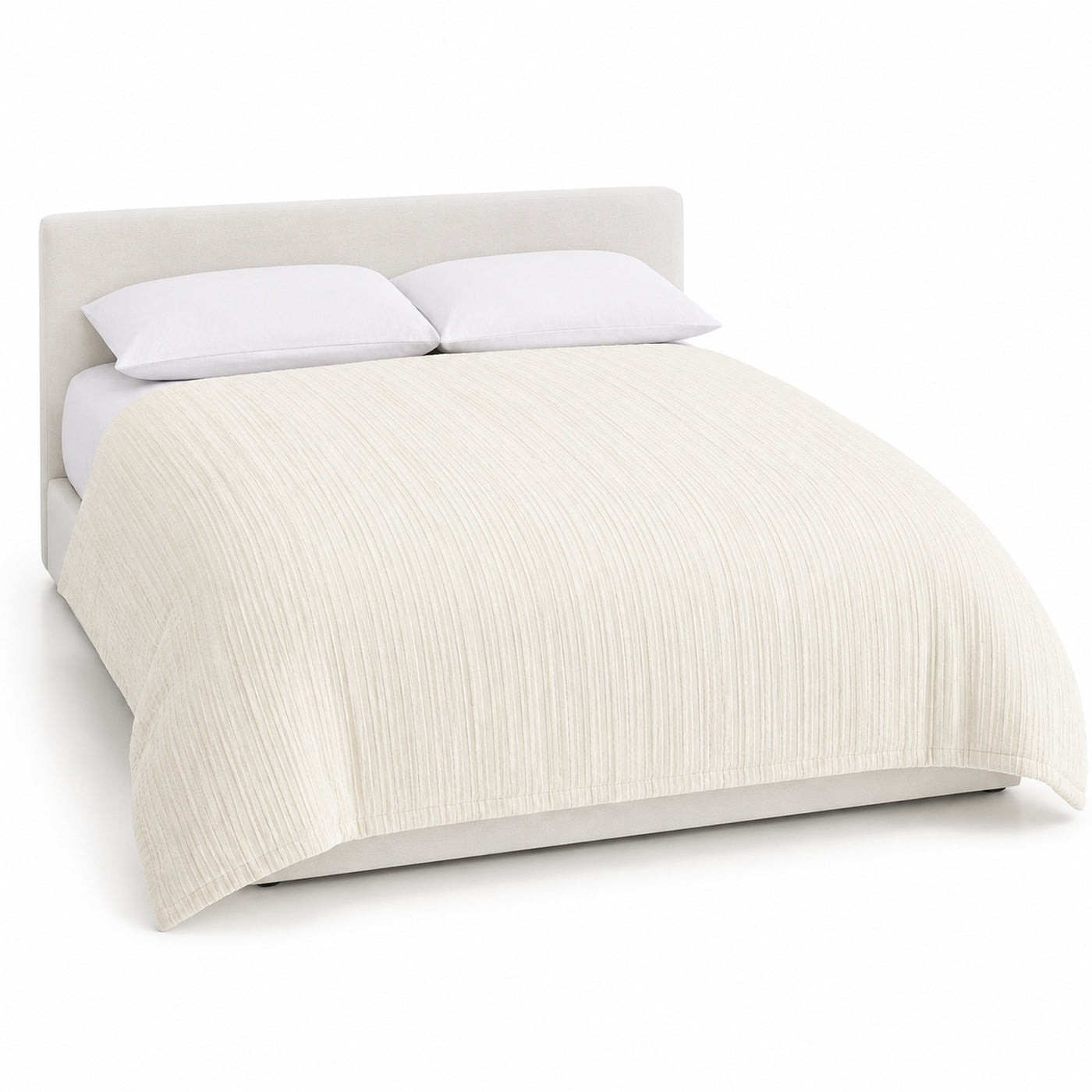 Primeval ivory vertical textured stripe duvet cover displayed on a styled bed against a clean white studio background