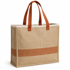 Natural jute tote bag with terracotta woven stripe detail and terracotta handles on a white background.