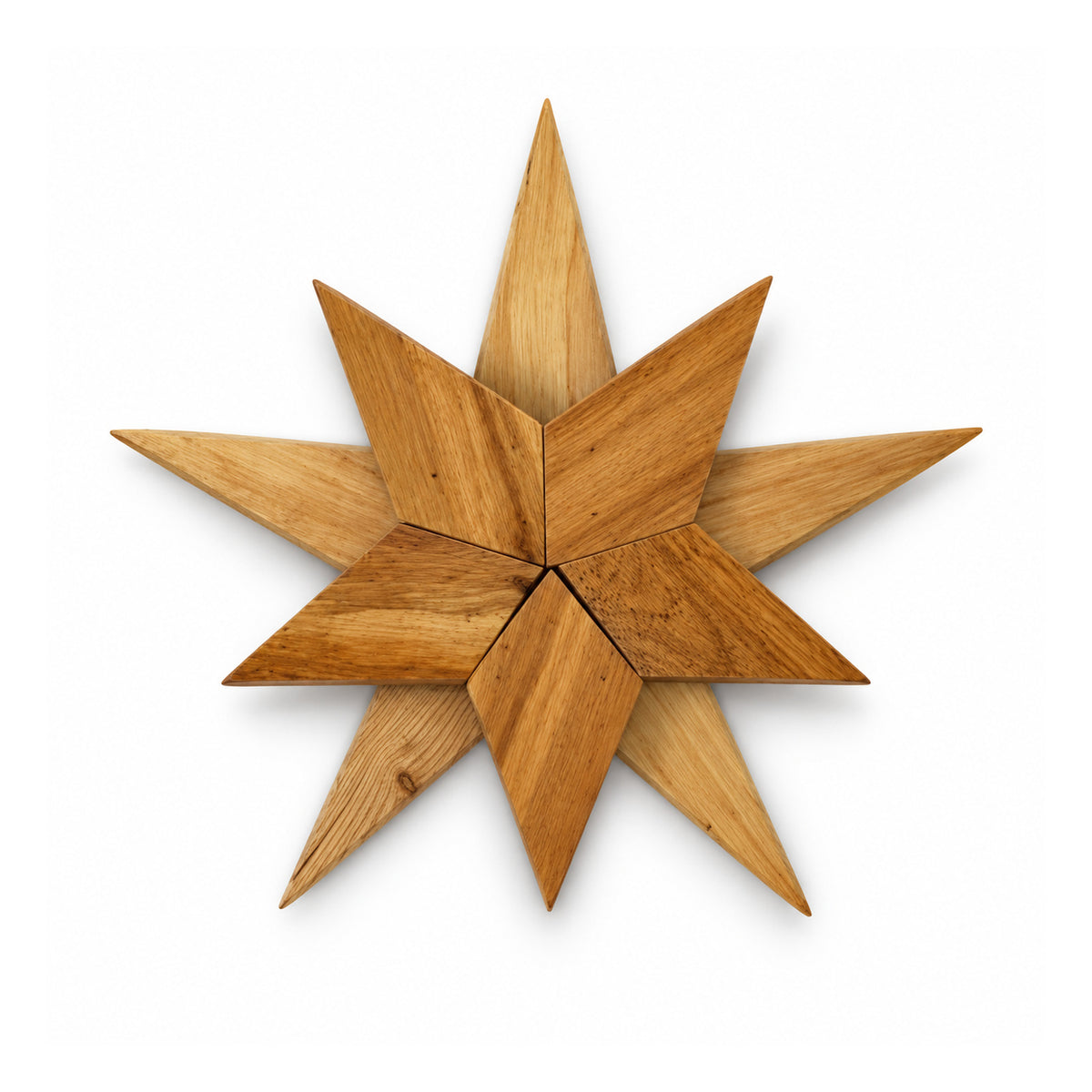 Eight-point natural wooden star wall decoration with overlapping pointed diamond-shaped slats and warm honey grain