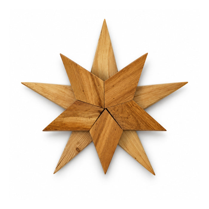 Eight-point natural wooden star wall decoration with overlapping pointed diamond-shaped slats and warm honey grain