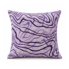 Primeval decorative throw cushion with lilac purple and deep violet flowing abstract contour lines, shown against a white background