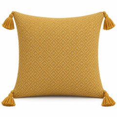 Mustard decorative cushion cover with subtle diamond texture and corner tassels