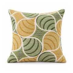Primeval mustard yellow and olive green cushion with overlapping circular swirls and curved retro geometric motifs