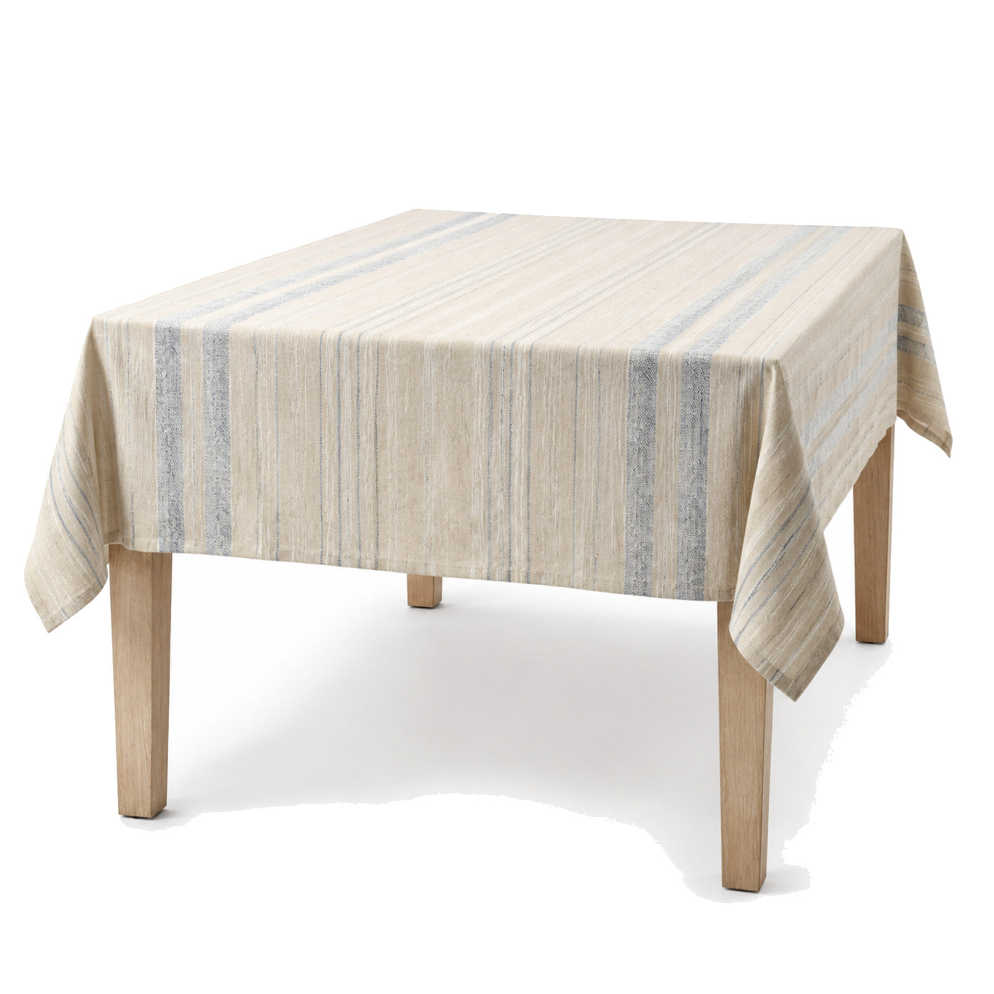 Primeval natural beige dusty blue ivory artisan stripe tablecloth displayed on a rectangular dining table