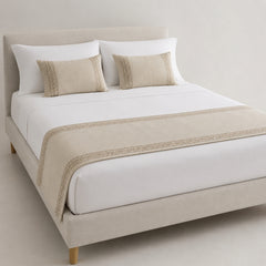 Natural beige minimalist border bed runner styled on white bedding for wholesale hotel, hospitality and private-label sourcing