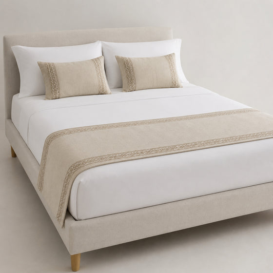 Natural beige minimalist border bed runner styled on white bedding for wholesale hotel, hospitality and private-label sourcing